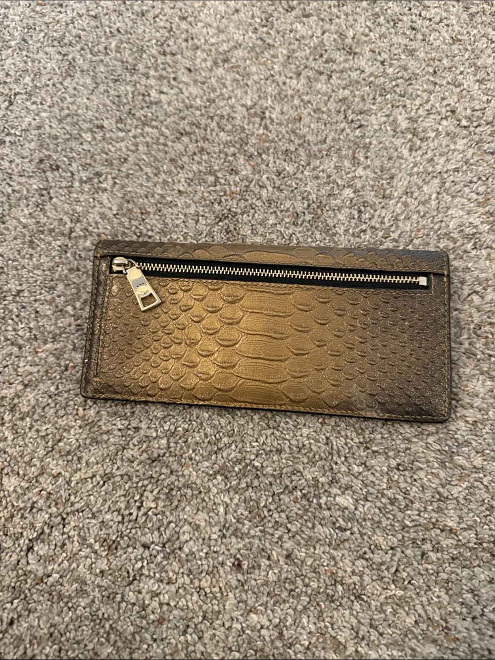 Coach Metallic snake-embossed leather envelope wallet in a muted gold tone